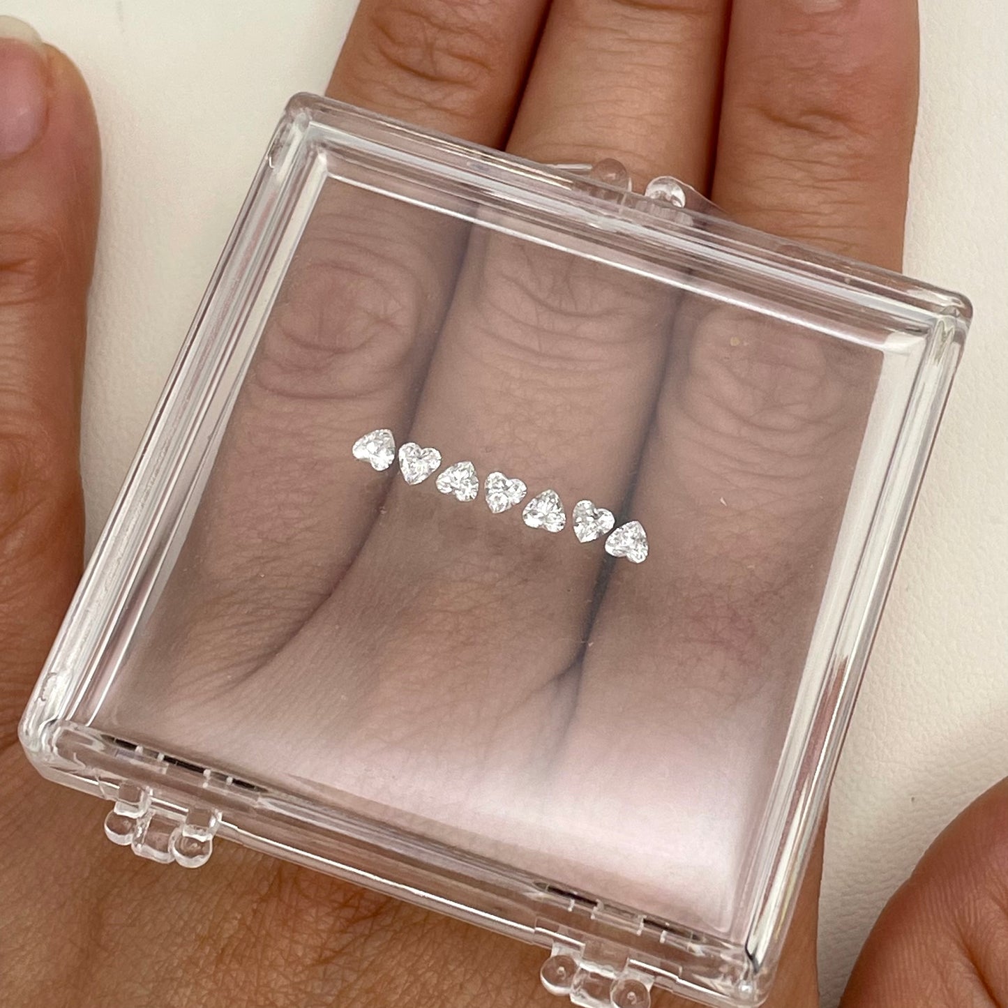 Gold ring with 7 lab Hearts