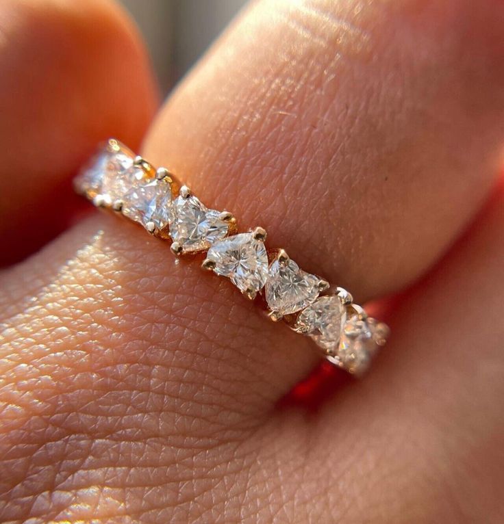 Gold ring with 7 lab Hearts